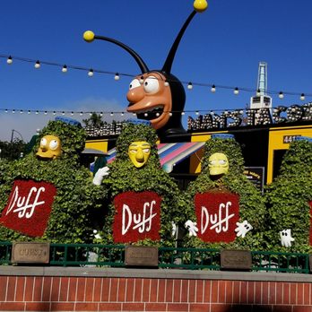Simpsons Land - Duff Gardens with Bumblee Man's taco truck peaking out from behind - Amusement Parks Near Me - Los Angeles, California Simpsons Land - Duff Gardens with Bumblee Man's taco truck peaking out from behind - Amusement Parks Near Me - Los Angeles, California