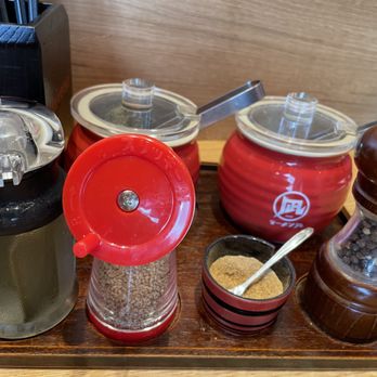 Ramen Nagi - condiments on table, konbu vinegar, mustard greens, spicy bean sprouts, sesame seeds, spicy fish powder, black pepper. - Ramen Near Me - San Diego, California Ramen Nagi - condiments on table, konbu vinegar, mustard greens, spicy bean sprouts, sesame seeds, spicy fish powder, black pepper. - Ramen Near Me - San Diego, California