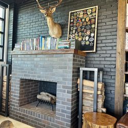 Black Rifle Coffee Company - Cute seating area by the fireplace.