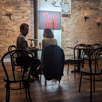 Tribeca Comedy Club - two people sitting at a table - Comedy Clubs Near Me - New York, New York Tribeca Comedy Club - two people sitting at a table - Comedy Clubs Near Me - New York, New York