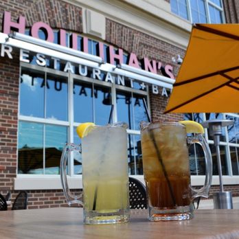 Houlihan's - two drinks on a table with an umbrella - New American Near Me - Hershey, Pennsylvania Houlihan's - two drinks on a table with an umbrella - New American Near Me - Hershey, Pennsylvania