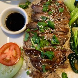 a plate of meat and vegetables
