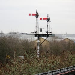 Greenford Underground Station - A gantry with a pair of Great Western style lower quadrant semaphore signals on the adjacent but seldom used High Wycombe to