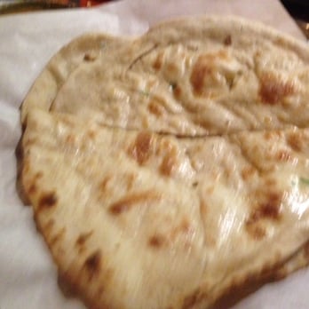 Nasha - Naan glistening in butter - Indian Near Me - Austin, Texas Nasha - Naan glistening in butter - Indian Near Me - Austin, Texas