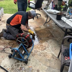 Drains R Us - Nick is clearing out my clogged drains in my patio before it rains.