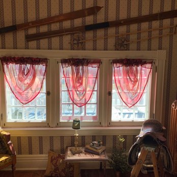 Noble Tea House - two windows with red curtains - Tea Rooms Near Me - High River, Alberta