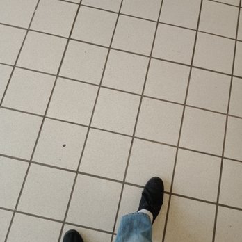 United Dairy Farmers - a person standing on a tiled floor - Convenience Stores Near Me - Cincinnati, Ohio