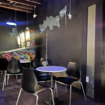 Loom - A couple of tables in the pinball machine area of the bar - Beer Bar Near Me - Indianapolis, Indiana