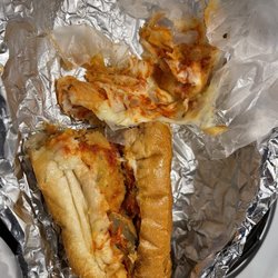 512 Restaurant - My eggplant parm with all the cheese on the parchment / wax paper ... barely any sauce.
