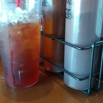 Famous Dave's Bar-B-Que - They keep a variety of bbq sauces at the table. There's something for every taste. - Barbeque Near Me - Aurora, Colorado