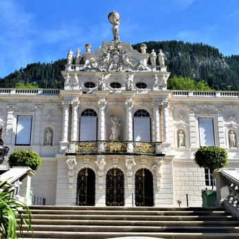 Schloss Linderhof - Front Entrance to the Castle from the Pond - Museums Near Me - Ettal, BY Schloss Linderhof - Front Entrance to the Castle from the Pond - Museums Near Me - Ettal, BY