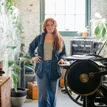 Gingerly Press - Lindsay, letterpress artist & owner next to her antique printing press in her studio. - Art Classes Near Me - Pittsburgh, Pennsylvania