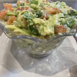 a bowl of guacamole a bowl of guacamole