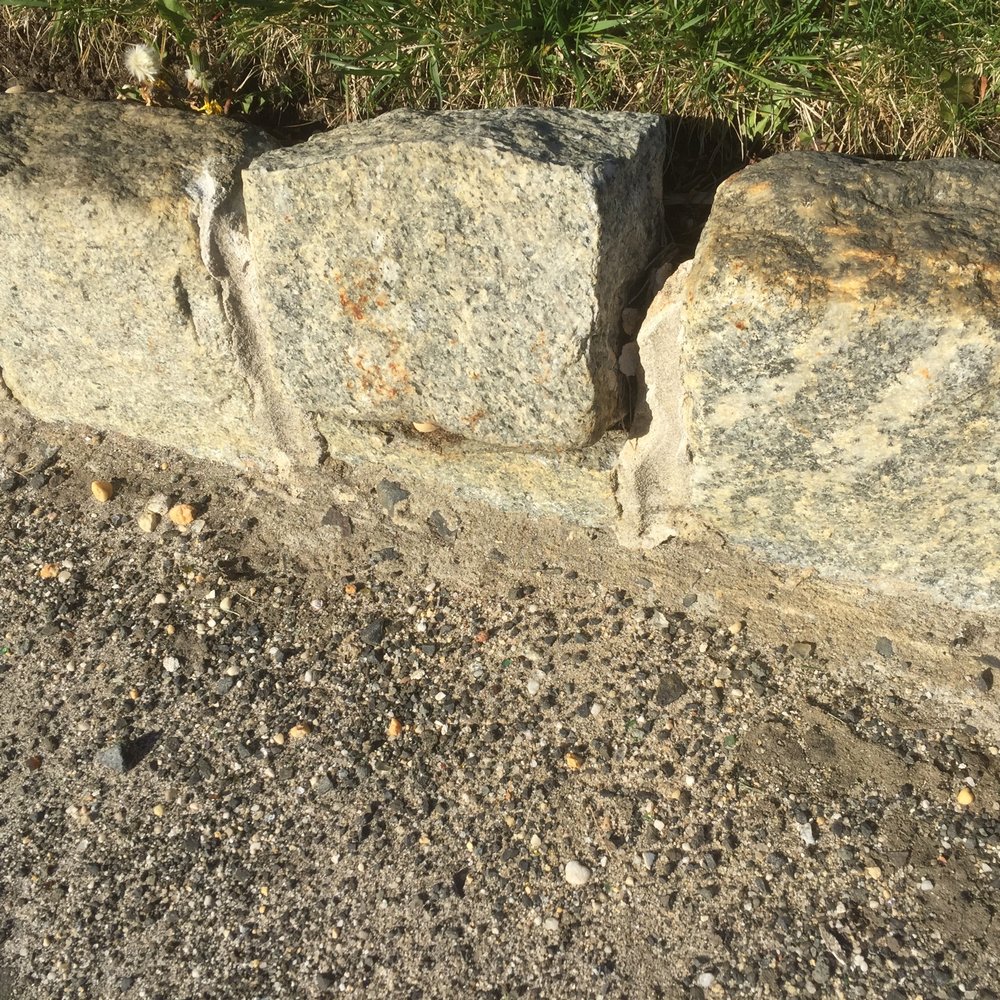 The Monello Group - a close up of a stone wall - General Contractors Near Me - Colts Neck, New Jersey The Monello Group - a close up of a stone wall - General Contractors Near Me - Colts Neck, New Jersey