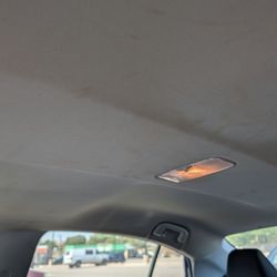 Hertz Car Rental - Stains all over the ceiling of the car