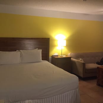 Vista Ventana - King bed and sitting area. The bed was a bit springy for me. Blanket was tucked under the sheets. - Hotels Near Me - Desert Hot Springs, California