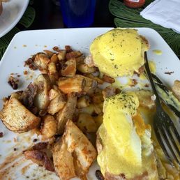 Eggs Benedict with home fries Eggs Benedict with home fries