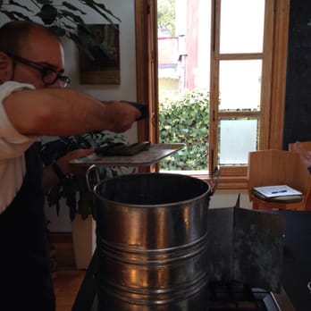 Casa Jacaranda - Jorge filling the pot with sweet corn tamales - Cooking Classes Near Me