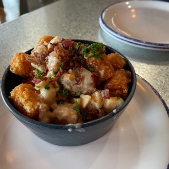 Slapfish - Seasonal side/appetizer: crispy Clam Chowder Tots ($6) with a clam-tasty chowder sauce, bacon and chives. - Seafood Near Me - Farmington, Utah Slapfish - Seasonal side/appetizer: crispy Clam Chowder Tots ($6) with a clam-tasty chowder sauce, bacon and chives. - Seafood Near Me - Farmington, Utah