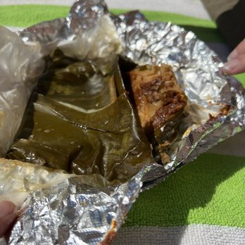 Taco Joint - This tamale looks like half of it was stepped on. Why is the tamale on the outside? - Mexican Near Me - Austin, Texas Taco Joint - This tamale looks like half of it was stepped on. Why is the tamale on the outside? - Mexican Near Me - Austin, Texas