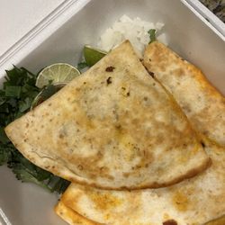 Birrieria el Patron - El pastor quesadilla with lime wedges and fresh cilantro/onion