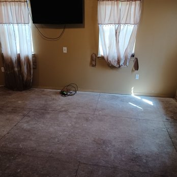 NoZone Construction - Another picture of the living room floor ripped up never replaced - General Contractors Near Me