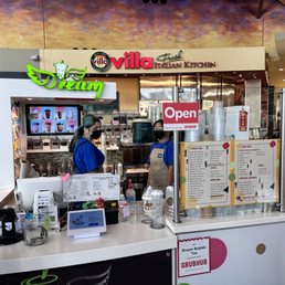 a woman standing at the counter a woman standing at the counter