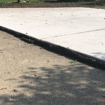 AAA Concrete Raising - The new slab was graded away from the house using the garage apron; they should have run a leveled guide line and raised the driveway. - Masonry/Concrete Near Me - Hoffman Estates, Illinois
