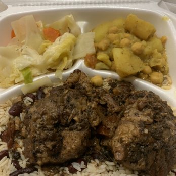 Tropical Bites - Caribbean Stew Oxtail with rice and peas, cabbage & veggies and a Side of Chickpeas and Potatoes (no flash photo) very bland tasting - Caribbean Near Me - Manassas, Virginia Tropical Bites - Caribbean Stew Oxtail with rice and peas, cabbage & veggies and a Side of Chickpeas and Potatoes (no flash photo) very bland tasting - Caribbean Near Me - Manassas, Virginia