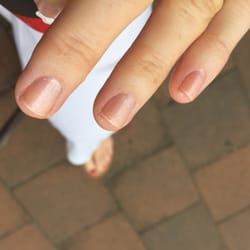 HK Nails - Unfinished cuticle removal and uneven filing.