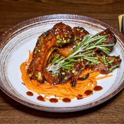 Mamajuana Cafe prime - Slow roasted ribs, smoke BBQ sauce