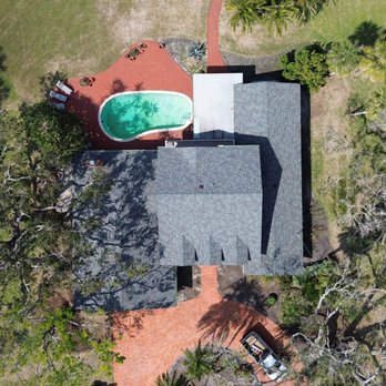 Evans Roofing - Fresh new shingle roof on this beautiful coastal home - built to withstand the elements and enhance curb appeal! - Roofing Near Me - Bradenton, Florida