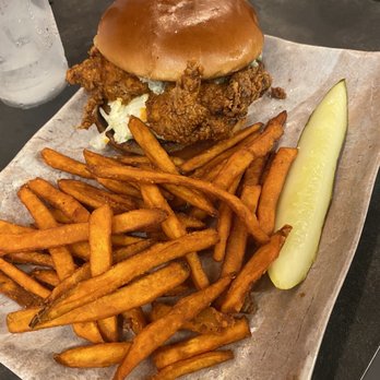 Pineapples - Buffalo Chicken Sandwich and sweet potato fries - Bars Near Me - Melbourne, Florida Pineapples - Buffalo Chicken Sandwich and sweet potato fries - Bars Near Me - Melbourne, Florida