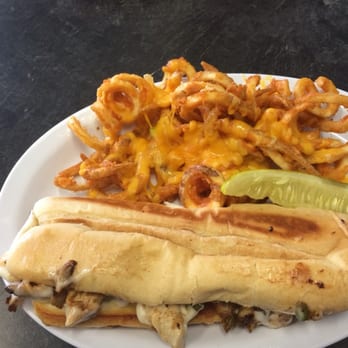 Mel's Diner - Chicken philly sandwich with cheesy curly fries and a pickle spear - Breakfast & Brunch Near Me - Port Orange, Florida Mel's Diner - Chicken philly sandwich with cheesy curly fries and a pickle spear - Breakfast & Brunch Near Me - Port Orange, Florida
