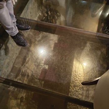 Alla Stella Nera - Glass floor looking down into cellar - Czech Near Me - Prague, Puerto Rico Alla Stella Nera - Glass floor looking down into cellar - Czech Near Me - Prague, Puerto Rico