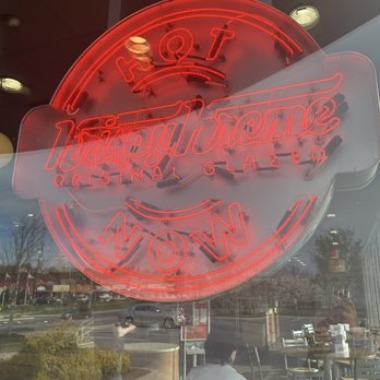 Krispy Kreme - a neon sign in a store window - Donuts Near Me - Frederick, Maryland