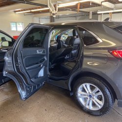 Magic Touch Hand Car Wash - Basic in and out service for my Ford Edge. They were still working on the tires when I took picture.