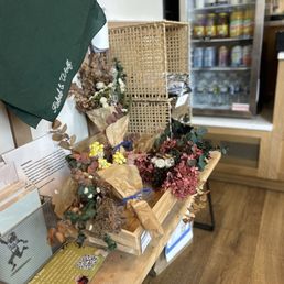 Display of art, dried flowers, and stickers to purchase Display of art, dried flowers, and stickers to purchase