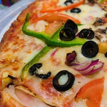 Jonathans Grille - a pizza with various toppings - Sports Bars Near Me - Nashville, Tennessee