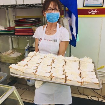 Pan Lido Salvadoreno - Co-owner with a freshly made platter of beauties! - Bakeries Near Me - San Francisco, California Pan Lido Salvadoreno - Co-owner with a freshly made platter of beauties! - Bakeries Near Me - San Francisco, California