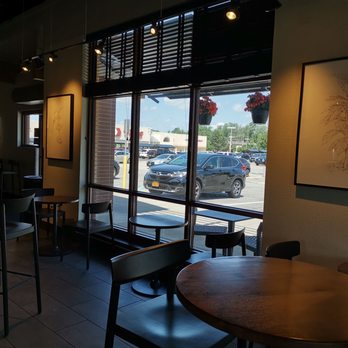 STARBUCKS - View of the small tables and one of the high tables. - Coffee & Tea Near Me - East Amherst, New York STARBUCKS - View of the small tables and one of the high tables. - Coffee & Tea Near Me - East Amherst, New York
