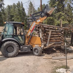 Titan Machinery - Moving a log trash shed