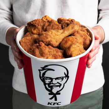 KFC - a person holding a bucket of fried chicken - Fast Food Near Me - Martensville, Saskatchewan KFC - a person holding a bucket of fried chicken - Fast Food Near Me - Martensville, Saskatchewan