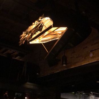 The Parlour - Dismantled piano hanging from roof - Pizza Near Me - Toronto, Ontario
