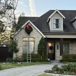 Top of Houston Christmas Light Installations - Hanging wreaths is fun!