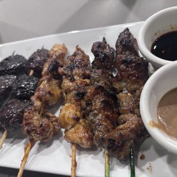 Gourmet Sate House - Mushroom skewers, spicy chicken and beef. Teriyaki sauce I think and peanut sauce - Indonesian Near Me - Pensacola, Florida