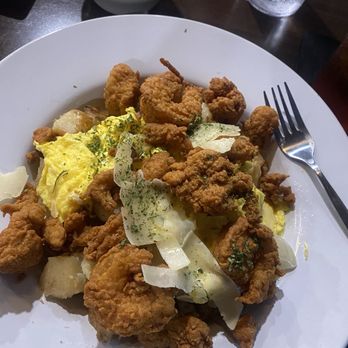 Orleans Bistro And Grill - Icrawfish, alligator bites, and shrimp over scrambled eggs with potatoes and onions. I had the sausage gravy on the side. - Southern Near Me - Fredericksburg, Virginia Orleans Bistro And Grill - Icrawfish, alligator bites, and shrimp over scrambled eggs with potatoes and onions. I had the sausage gravy on the side. - Southern Near Me - Fredericksburg, Virginia