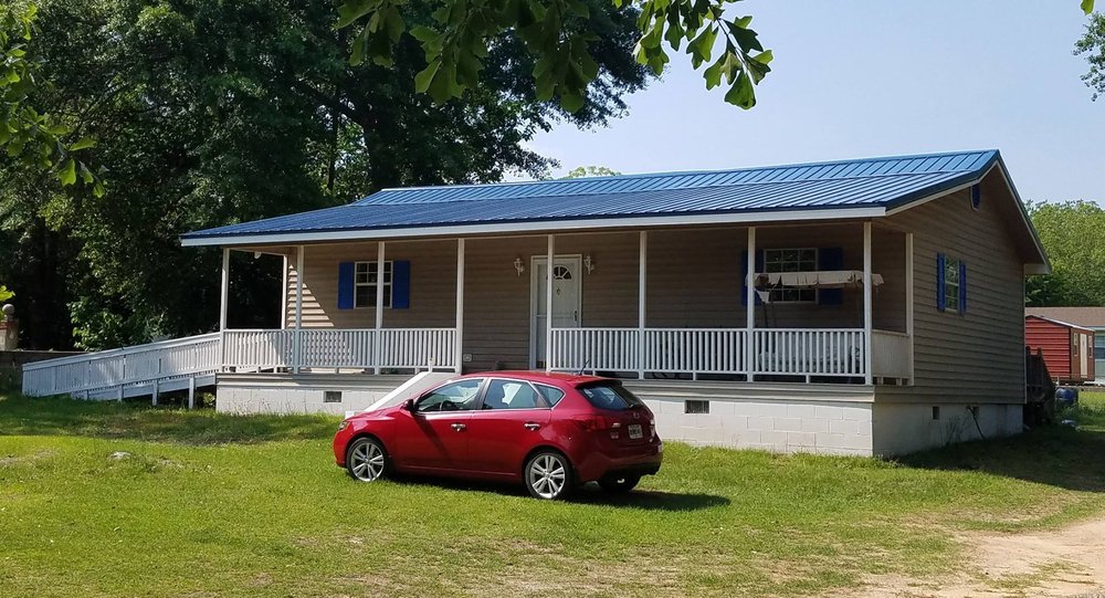 Slide of Whitt's Quality Roofing