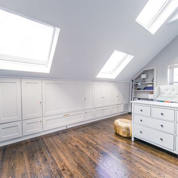 HB Home Improvement - an attic bedroom with a bed and dressers - General Contractors Near Me - wuborn, Massachusetts