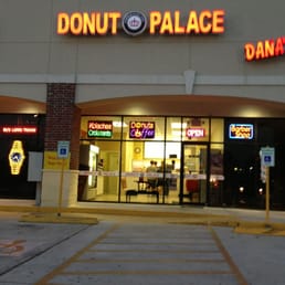 a donut palace storefront at night a donut palace storefront at night